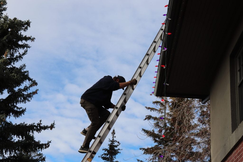 Holiday Lighting Safety Tips for Snowy Roofs and Icy Ladders in Denver, CO